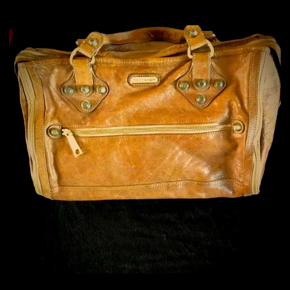 Distressed oversized handbag for wrist or elbow